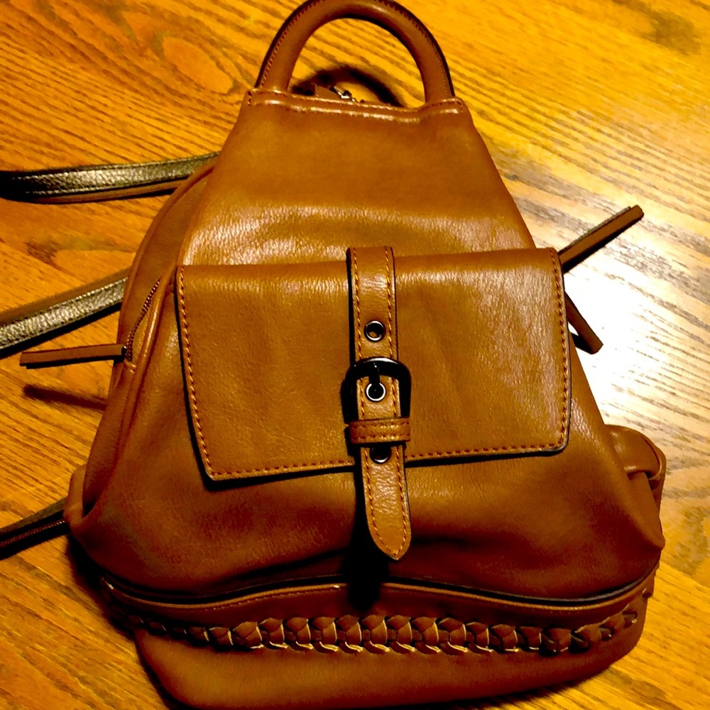 KGB STUDIO ADJUSTABLE BACK PACK OR HANDLE HANDBAG. Perfect condition.